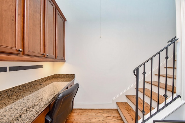 4006 Feagan St Unit D, Houston, TX 77007 - office area featuring light wood finished floors, built in study area, and baseboards