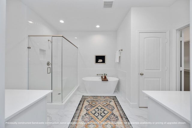 222 E 27th St, Houston, TX 77008 - full bath featuring marble finish floors, a stall shower, a freestanding bath, and recessed lighting