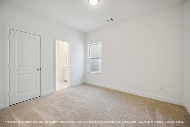 222 E 27th St, Houston, TX 77008 - unfurnished bedroom featuring carpet, baseboards, and connected bathroom