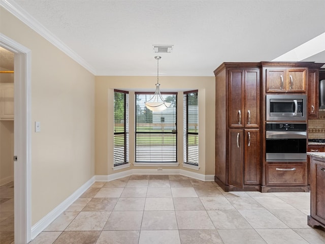 22103 Ancla St, Crosby, TX 77532 - unfurnished dining area with ornamental molding, baseboards, and light tile patterned flooring