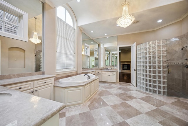 3110 Noble Lakes Ln, Houston, TX 77082 - bathroom featuring a stall shower, two vanities, a garden tub, a chandelier, and crown molding