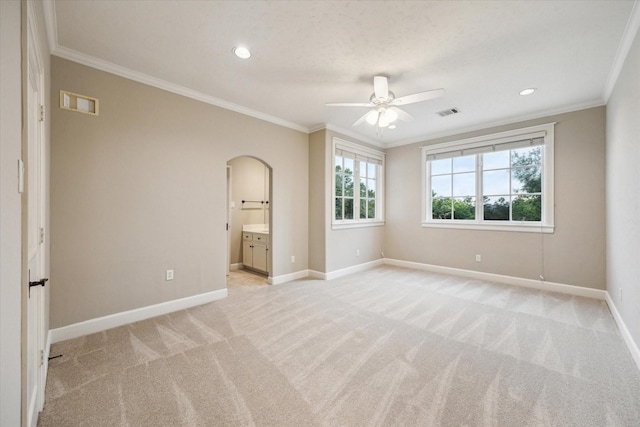 3110 Noble Lakes Ln, Houston, TX 77082 - unfurnished bedroom featuring arched walkways, light carpet, crown molding, baseboards, and recessed lighting
