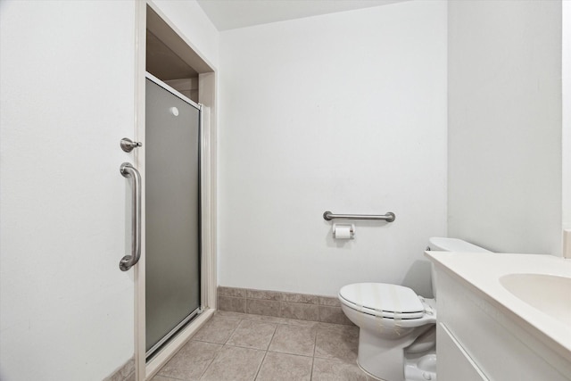 17019 Mclean Rd, Pearland, TX 77584 - bathroom with tile patterned floors, a stall shower, toilet, vanity, and baseboards