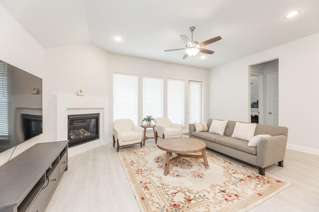 29446 Pearwood Dr, Katy, TX 77494 - living area with ceiling fan, a glass covered fireplace, light wood-type flooring, recessed lighting, and baseboards