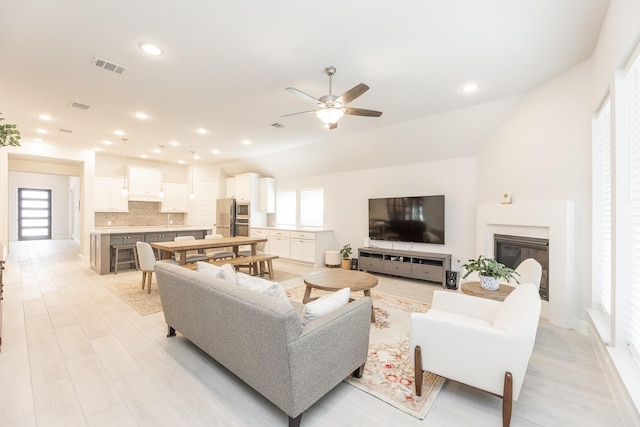 29446 Pearwood Dr, Katy, TX 77494 - living area with ceiling fan, recessed lighting, and a glass covered fireplace