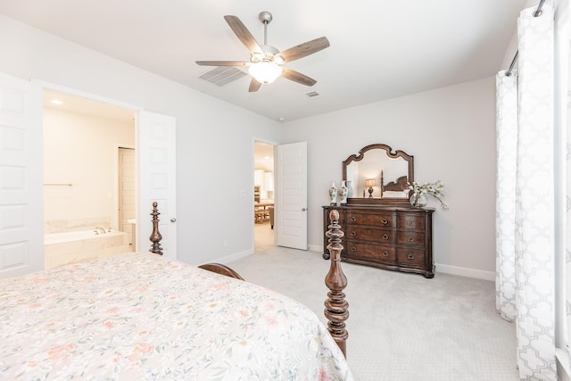 29446 Pearwood Dr, Katy, TX 77494 - bedroom featuring baseboards, light colored carpet, ensuite bath, and ceiling fan