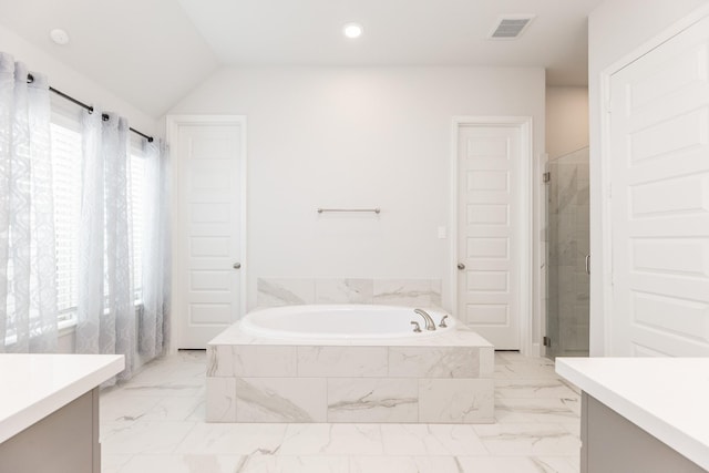 29446 Pearwood Dr, Katy, TX 77494 - bathroom featuring vanity, marble look tiles, a bath, recessed lighting, and vaulted ceiling
