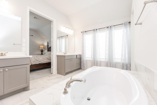 29446 Pearwood Dr, Katy, TX 77494 - bathroom featuring vaulted ceiling, vanity, a bath, ensuite bathroom, and marble finish flooring