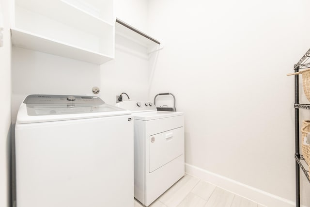 29446 Pearwood Dr, Katy, TX 77494 - laundry area with independent washer and dryer and baseboards