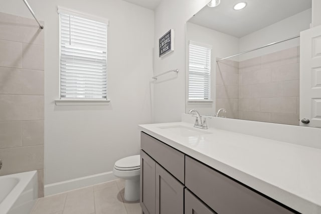 7314 Autumn Sage Dr, Katy, TX 77493 - bathroom featuring tile patterned floors, toilet, vanity, baseboards, and bathtub / shower combination