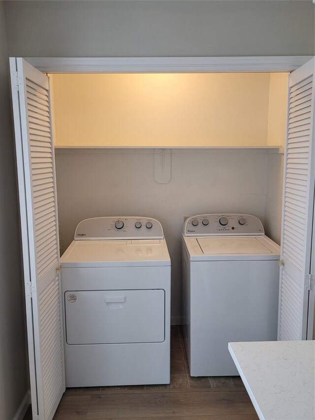 2300 Old Spanish Trl Unit 2136, Houston, TX 77054 - clothes washing area featuring washer and dryer and dark wood-style floors