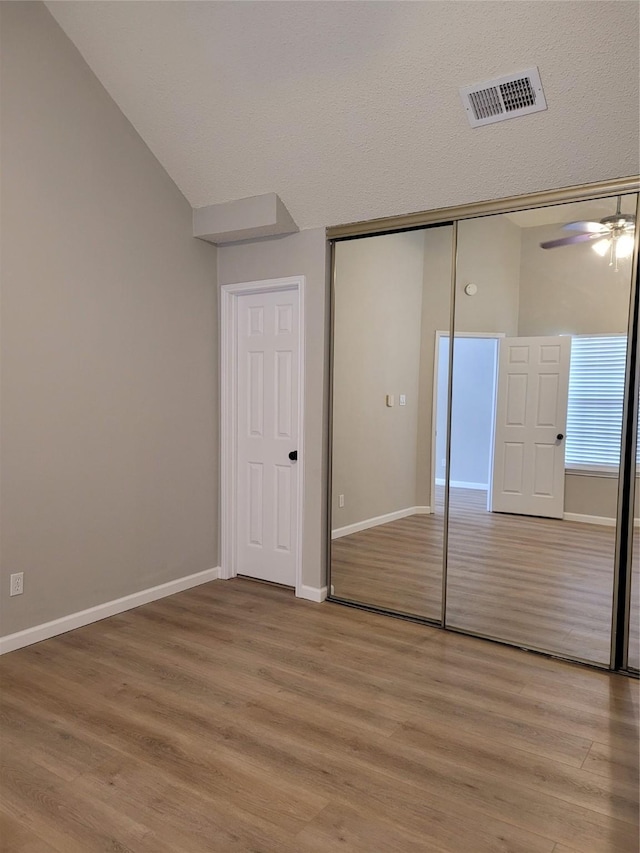 2300 Old Spanish Trl Unit 2136, Houston, TX 77054 - unfurnished bedroom featuring light wood-style floors, a closet, and baseboards