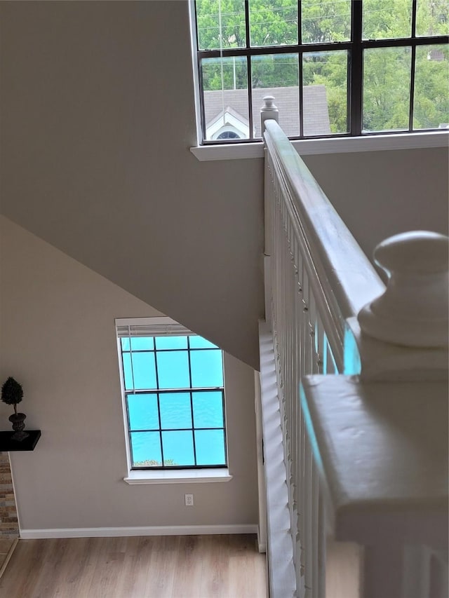 2300 Old Spanish Trl Unit 2136, Houston, TX 77054 - staircase featuring baseboards, wood finished floors, and healthy amount of natural light