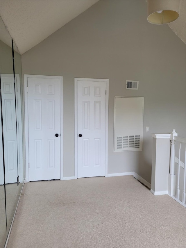 2300 Old Spanish Trl Unit 2136, Houston, TX 77054 - unfurnished bedroom featuring high vaulted ceiling, carpet, and baseboards