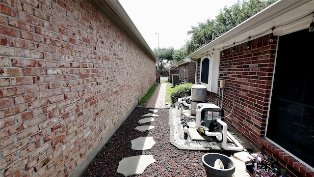 1314 Caravelle Ct, Katy, TX 77494 - view of side of property featuring brick siding and central air condition unit