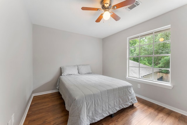 37 S Piney Plains Cir, The Woodlands, TX 77382 - bedroom featuring baseboards, wood finished floors, and a ceiling fan