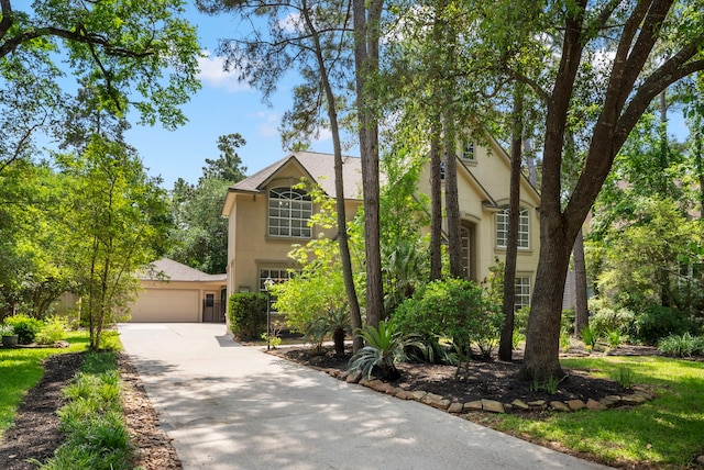 37 S Piney Plains Cir, The Woodlands, TX 77382 - traditional home with stucco siding and a garage