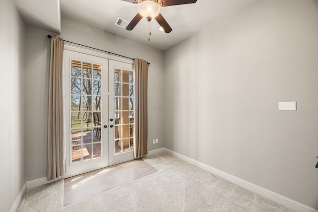 entryway with carpet floors, ceiling fan, french doors, and baseboards