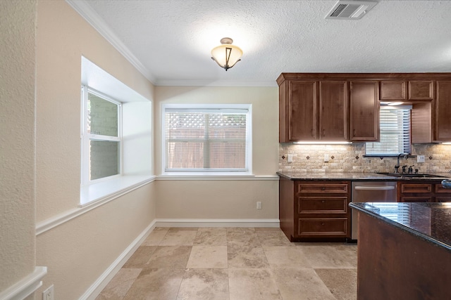 11243 Rousseau Dr, Houston, TX 77065 - kitchen with a sink, tasteful backsplash, dark stone counters, ornamental molding, and baseboards
