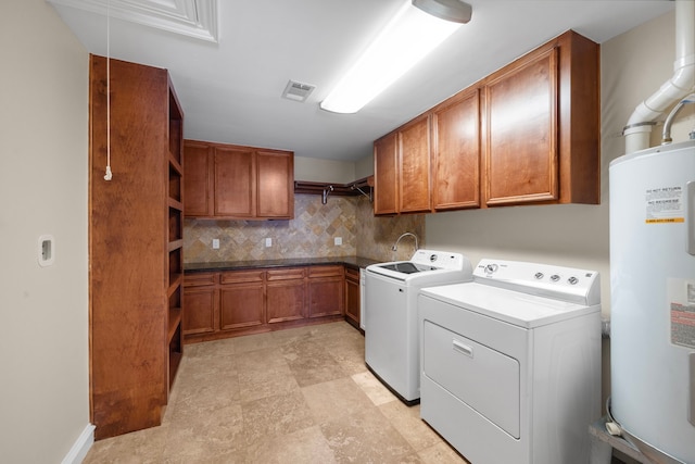 11243 Rousseau Dr, Houston, TX 77065 - washroom featuring water heater, cabinet space, and washing machine and clothes dryer