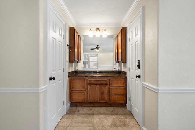 11243 Rousseau Dr, Houston, TX 77065 - bathroom featuring vanity, crown molding, a ceiling fan, a textured ceiling, and baseboards