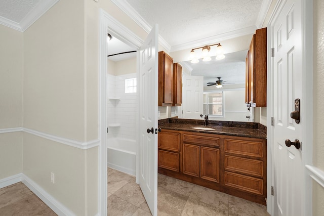11243 Rousseau Dr, Houston, TX 77065 - full bath with vanity, crown molding, a textured ceiling, ceiling fan, and washtub / shower combination