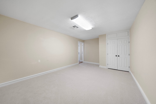 11243 Rousseau Dr, Houston, TX 77065 - unfurnished bedroom featuring a closet, light carpet, and baseboards