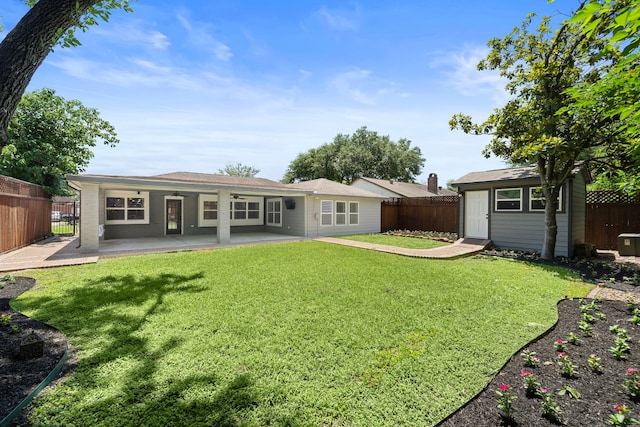 11243 Rousseau Dr, Houston, TX 77065 - back of property with a patio area, an outdoor structure, and a ceiling fan