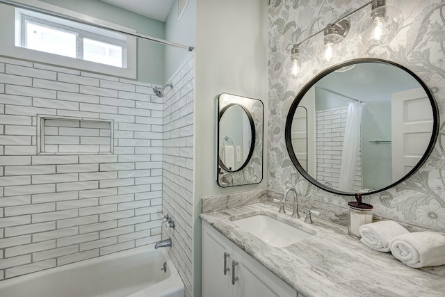 1016 Louise St, Houston, TX 77009 - bathroom with wallpapered walls, shower / bath combo with shower curtain, and vanity