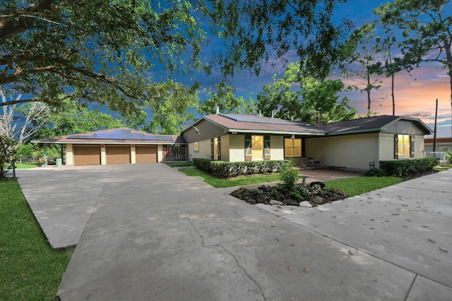 5103 Diamond Springs Dr, Missouri City, TX 77459 - ranch-style house featuring solar panels, concrete driveway, a porch, a garage, and fence
