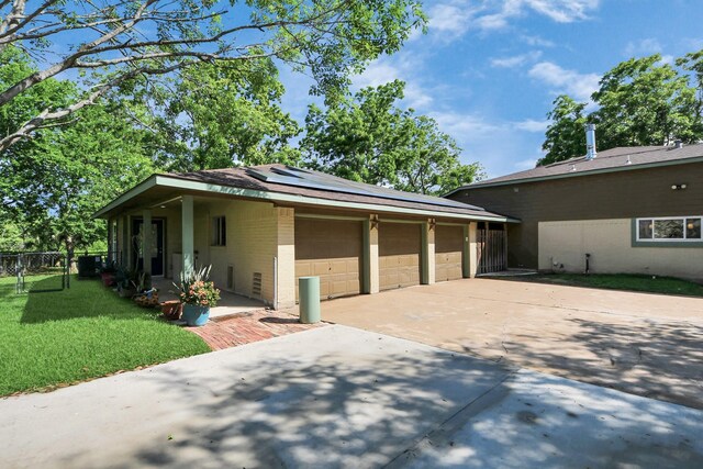5103 Diamond Springs Dr, Missouri City, TX 77459 - view of front of property featuring concrete driveway, solar panels, and brick siding