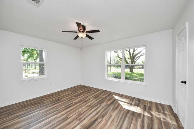 5103 Diamond Springs Dr, Missouri City, TX 77459 - unfurnished bedroom featuring dark wood-style floors, baseboards, and ceiling fan
