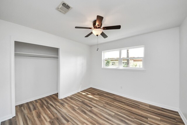 5103 Diamond Springs Dr, Missouri City, TX 77459 - unfurnished bedroom with wood finished floors, a closet, baseboards, and a ceiling fan