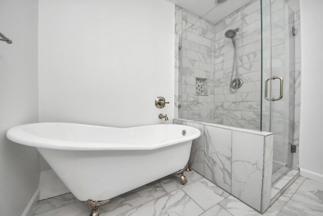 5103 Diamond Springs Dr, Missouri City, TX 77459 - bathroom with marble look tiles, a shower stall, a soaking tub, and baseboards