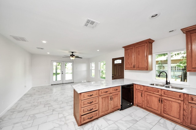 5103 Diamond Springs Dr, Missouri City, TX 77459 - kitchen with a sink, light marble finish flooring, dishwasher, a peninsula, and recessed lighting