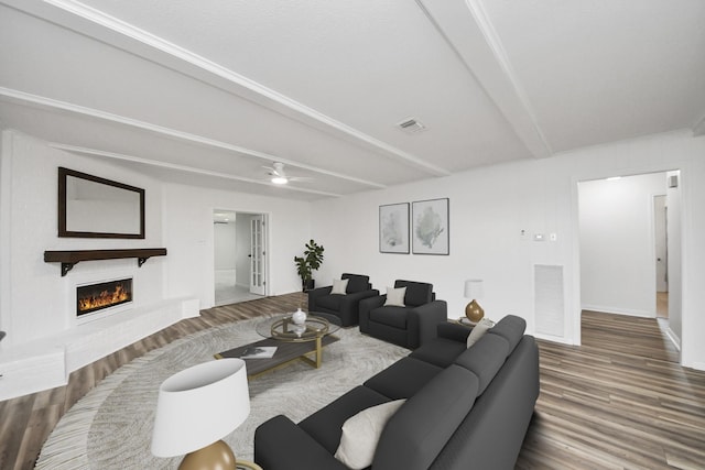 5103 Diamond Springs Dr, Missouri City, TX 77459 - living room with wood finished floors, a fireplace, beam ceiling, baseboards, and a ceiling fan