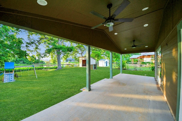 5103 Diamond Springs Dr, Missouri City, TX 77459 - view of patio with a storage shed, ceiling fan, and an outbuilding