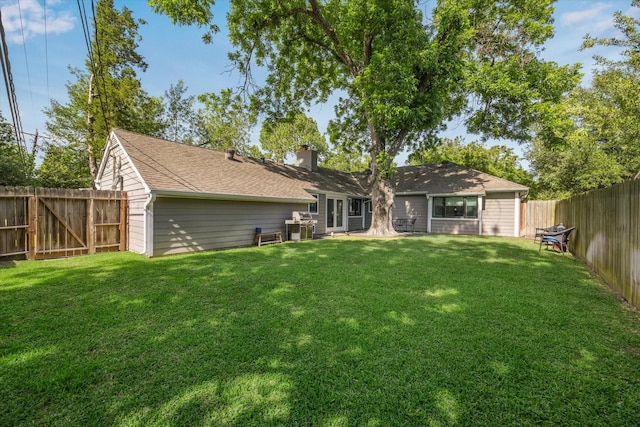 2514 Briarbrook Dr, Houston, TX 77042 - rear view of house with a chimney and a shingled roof
