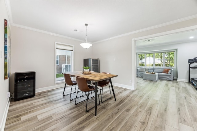 2514 Briarbrook Dr, Houston, TX 77042 - dining room featuring light wood finished floors, ornamental molding, baseboards, and heating unit