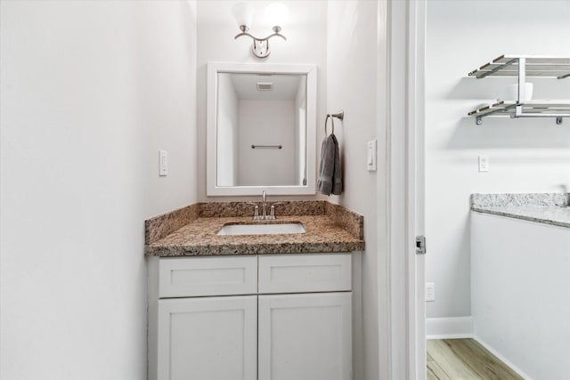2514 Briarbrook Dr, Houston, TX 77042 - bathroom with vanity, wood finished floors, and baseboards