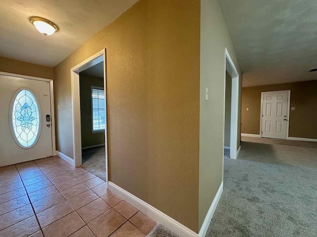 207 Lucky Dr, Silsbee, TX 77656 - entrance foyer with plenty of natural light, baseboards, and a textured wall