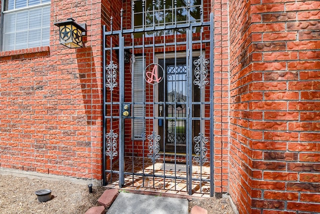 11707 Turtle Lake Dr, Houston, TX 77064 - property entrance featuring brick siding and a gate
