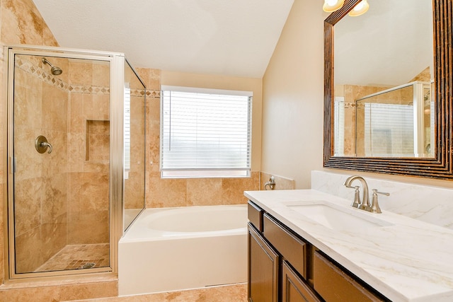 11707 Turtle Lake Dr, Houston, TX 77064 - bathroom with vaulted ceiling, a shower stall, a garden tub, and vanity