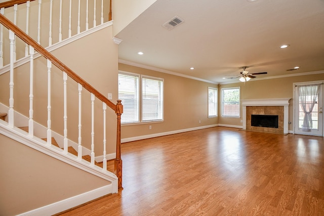 11707 Turtle Lake Dr, Houston, TX 77064 - unfurnished living room with crown molding, ceiling fan, recessed lighting, stairs, and baseboards