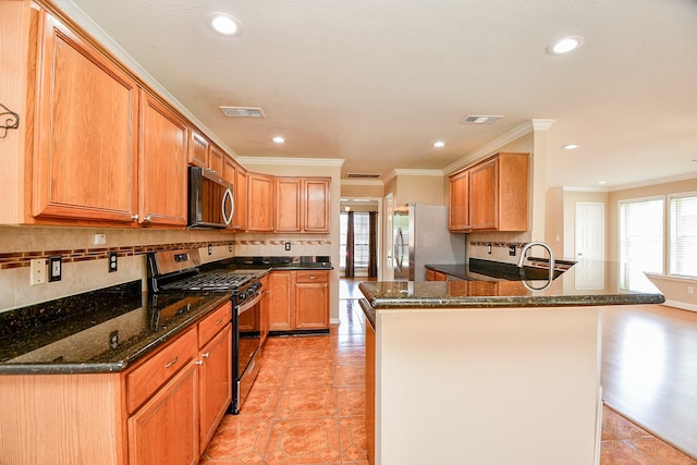 11707 Turtle Lake Dr, Houston, TX 77064 - kitchen with appliances with stainless steel finishes, ornamental molding, a peninsula, tasteful backsplash, and light tile patterned flooring