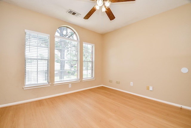 11707 Turtle Lake Dr, Houston, TX 77064 - spare room with ceiling fan, light wood-style floors, and baseboards