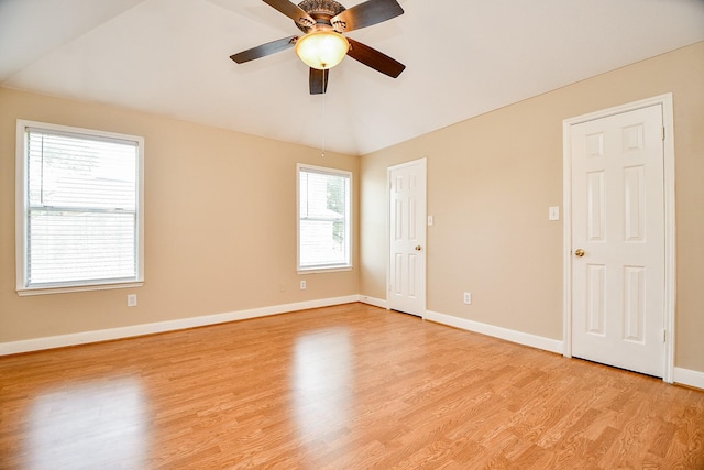 11707 Turtle Lake Dr, Houston, TX 77064 - empty room with light wood finished floors, baseboards, ceiling fan, and vaulted ceiling