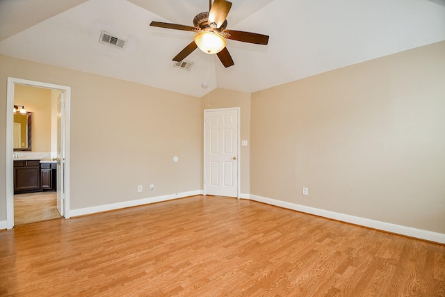 11707 Turtle Lake Dr, Houston, TX 77064 - spare room featuring vaulted ceiling, ceiling fan, light wood-type flooring, and baseboards