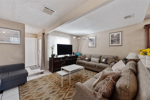 12574 Newbrook Dr, Houston, TX 77072 - living room featuring a textured ceiling and light tile patterned floors