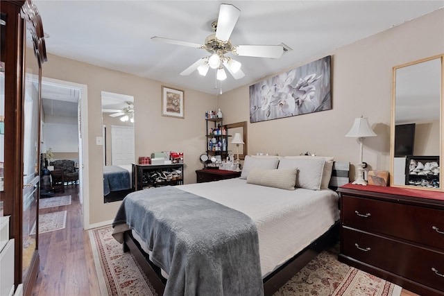 12574 Newbrook Dr, Houston, TX 77072 - bedroom with wood finished floors and a ceiling fan